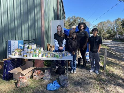 Students with the Columbia High FBLA program helped pass out food this past weekend with the Kids Feeding Kids Thanksgiving program. (COURTESY)