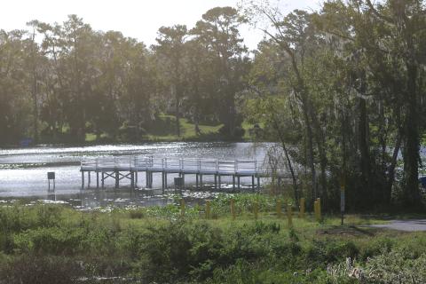 A metal pier sits on the banks of Lake Montgomery. The second phase of work at Campbell Park is expected to begin after delays caused by Hurricanes Helene and Milton. (TONY BRITT/Lake City Reporter)