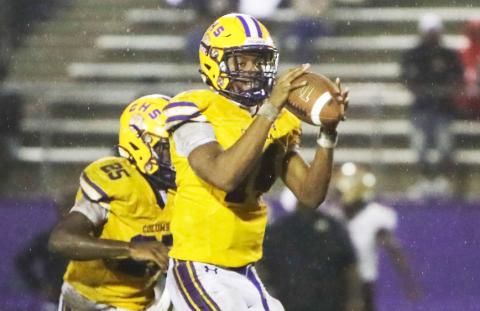 Columbia quarterback Xavier Collins gathers a snap in the rain during the Tigers’ contest against St. Augustine on Sept. 25. (BRENT KUYKENDALL/Lake City Reporter)
