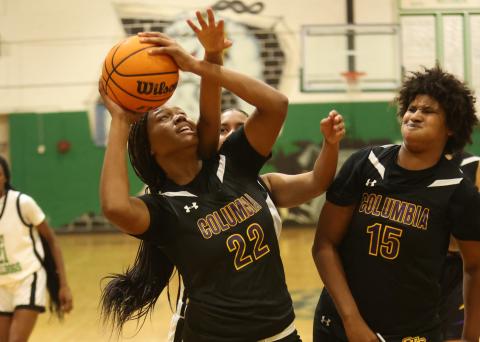 Columbia forward Dariyan Williams (22) tries to get off a shot against Suwannee on Friday. (PAUL BUCHANAN/Lake City Reporter)