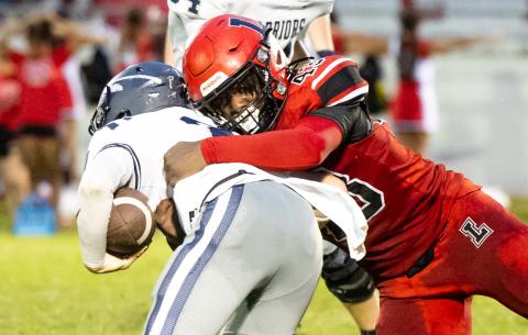 Lafayette defensive lineman Zamarion Hawkins makes a tackle against Brookwood on Sept. 6. (JACK HOWDESHELL/Lake City Reporter)
