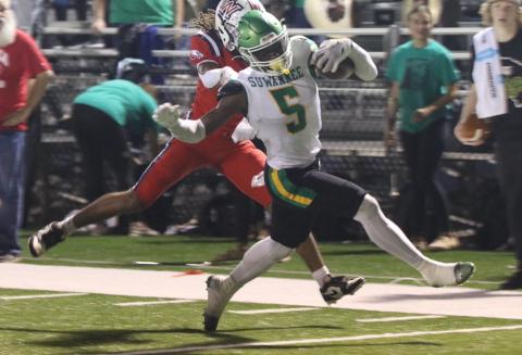 Suwannee receiver MJ Rossin evades a Wakulla defender on his way to the end zone for a touchdown in the first quarter of Thursday’s game. (MORGAN MCMULLEN/Lake City Reporter)