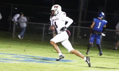 Fort White receiver Mike Peterson Jr. scores on a 14-yard touchdown pass in the third quarter of Friday’s playoff game against Jay. (MORGAN MCMULLEN/Lake City Reporter)