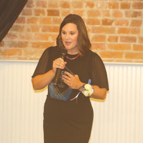 Westside Elementary School’s Shelly Teel speaks to the crowd after winning the Columbia County Teacher of the Year award. (TONY BRITT/Lake City Reporter)