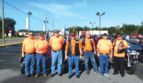 A group of riders for the Toys For Tots Toy Run poses during the 2022 ride. (FILE)