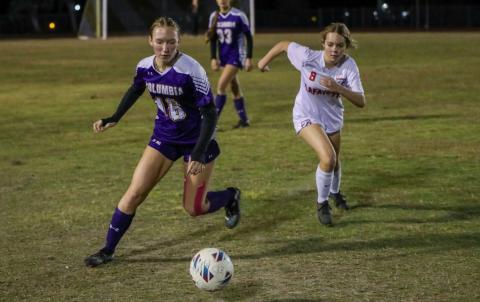 Columbia's Jenavieve Farer and Lafayette's Mya Pilkington chase after possession of the ball on Monday night. (BRENT KUYKENDALL/Lake City Reporter)