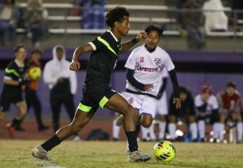 Columbia's Cayden Weatherspoon dribbles up the field against Lafayette on Monday. (BRENT KUYKENDALL/Lake City Reporter)