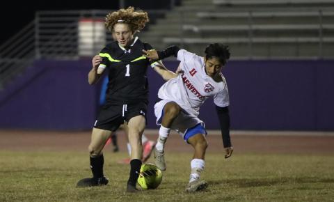 Columbia's Brendan Schwartz (left) and Lafayette's Elder Santiago (right) battle for possession of the ball on Dec. 2. (BRENT KUYKENDALL/Lake City Reporter)