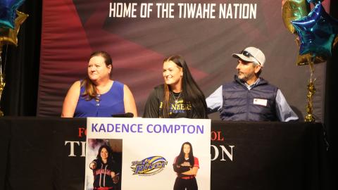 Fort White softball pitcher Kadence Compton (middle) smiles during her signing ceremony Wednesday alongside his mother, Lora, and her father, Paul. Compton signed her letter of intent to play collegiately at Indian River State College. (MORGAN MCMULLEN/Lake City Reporter)