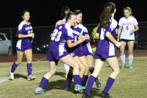 Columbia's Sydney Agner (23) celebrates with Laella Thompson after Thompson scored a goal against Santa Fe on Monday night. (JORDAN KROEGER/Lake City Reporter)