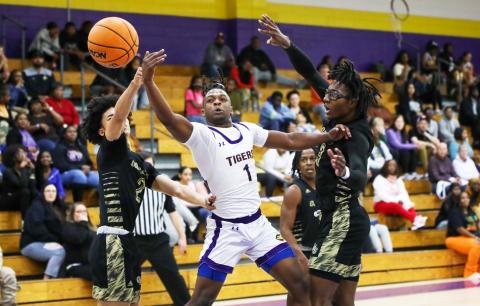 Columbia guard Zamarion Jones has the ball knocked away by Oakleaf guard Jarius Brown (2) on Friday night. (BRENT KUYKENDALL/Lake City Reporter)