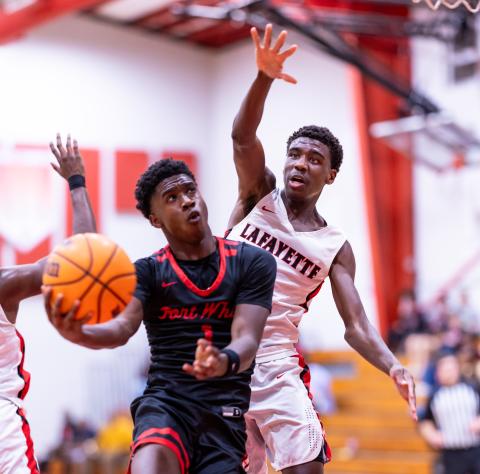 Fort White guard Jayden Jackson drives for a shot as Lafayette guard Jordan Murphy defends Thursday night. Jackson scored 24 points to lead the Indians to a 61-33 win. (JACK HOWDESHELL/Lake City Reporter)