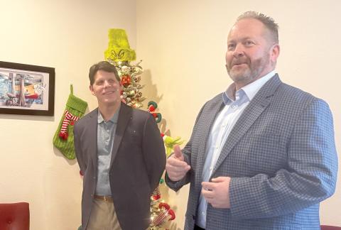 Lake City Reporter Publisher Todd Wilson (right) speaks Monday after Community Newspapers, Inc.  President Mark Major announced Wilson’s promotion to the company’s Southeast Regional Publisher. In his role, Wilson will also oversee the News-Leader of Fernandina Beach, the Nassau County Record of Callahan and the Tribune & Georgian of St. Marys, Ga., in addition to the Reporter. Wilson will be based in Lake City. (JAMIE WACHTER/Lake City Reporter)