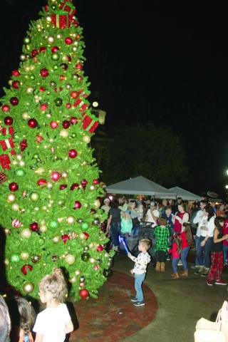 Hundreds attended last year’s Christmas tree lighting ceremony in Olustee Park. This year’s event is set for Sunday. (FILE)