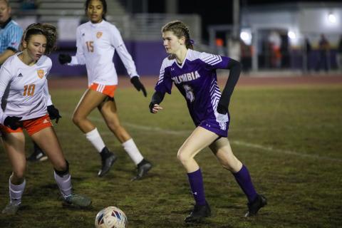 Columbia's Niki Sossie dribbles the ball up the field during a match against Orange Park on Jan. 9. (BRENT KUYKENDALL/Lake City Reporter)