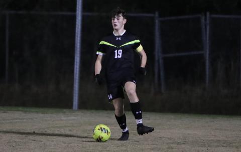 Columbia's Mathan Cook looks up field with possession of the ball during a match against Gainesville on Jan.  10. (BRENT KUYKEDALL/Lake City Reporter)