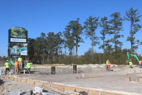 A crew works on the U-Haul storage facility site in the Gateway Crossing development Friday at the Interstate 75 and U.S. Highway 90 interchange. (TONY BRITT/Lake City Reporter)
