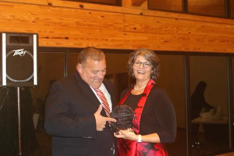 Branford High history teacher Karen Braun celebrates with her husband, Mike, after being named Suwannee County’s Teacher of the Year on Tuesday. (TONY BRITT/Lake City Reporter)