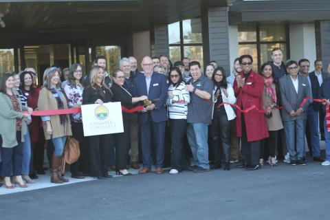 A crowd of area business owners, residents and local supporters attend the ribbon cutting ceremony for the Courtyard by Marriott on Tuesday afternoon. (TONY BRITT/Lake City Reporter)