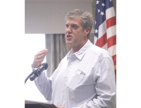 Brad Dicks talks about his beginnings in real estate by helping his father, Lenvil, mark roads in a subdivision nearly 50 years ago. Dicks was named the Lake City Board of Realtors’ Realtor of the Year on Monday. (JAMIE WACHTER/Lake City Reporter)