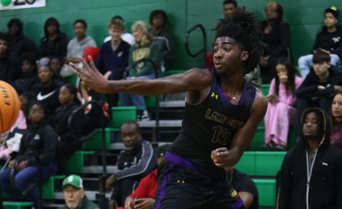 Columbia forward Zavian Douglas saves the ball from going out of bounds during Friday's game against Suwannee. (PAUL BUCHANAN/Lake City Reporter)