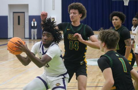 Columbia forward Zavian Douglas gathers the ball to shoot against Forest in the Hitchcock's Challenge championship on Dec. 29. (JORDAN KROEGER/Lake City Reporter)