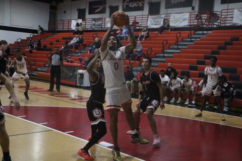 Fort White guard Tafari Moe goes for a layup during Monday's win against Middleburg. (MORGAN MCMULLEN/Lake City Reporter)