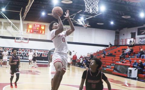 Fort White guard Tafari Moe rises for a layup during Monday’s win over Middleburg. (MORGAN MCMULLEN/Lake City Reporter)