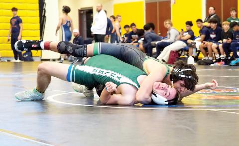 Suwannee’s Jose Garcia pinned Yulee’s Ethan McFeely at 144 pounds during the Region 1-1A duals championship match at the state duals meet. (DEE DEE JOLICOEUR/Special to the Reporter)