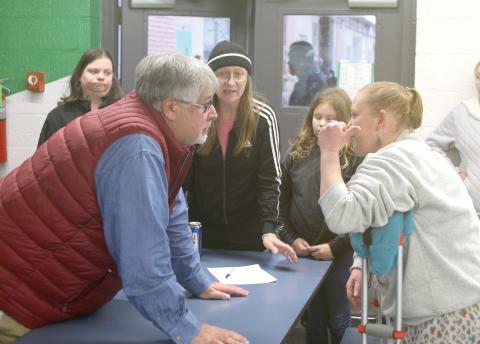 Columbia County Superintendent Keith Couey discusses the closure of Five Points Elementary School and the new proposed zoning for elementary school students with parents and community members Tuesday at a town hall meeting. (TONY BRITT/Lake City Reporter)