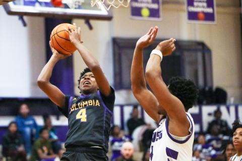 Columbia guard Shaheed White shoots while defended by Gainesville forward Cornelius White on Jan. 23. (BRENT KUYKENDALL/Lake City Reporter)