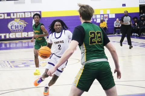Columbia guard Kadrian Wilson pushes the ball up the floor in transition during Saturday's win over Suwannee. (JORDAN KROEGER/Lake City Reporter)