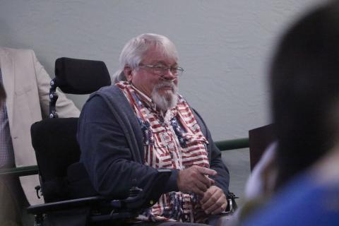 Jeff Woods, a disabled veteran, pleads through tears with Sen. Jennifer Bradley and Rep. Chuck Brannan to provide help with the misuse of handicapped parking spaces. (JAMIE WACHTER/Lake City Reporter)