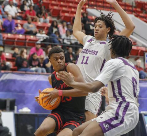 Fort White guard Kendal Henry gets double teamed by Crossroad Academy forward Trenton Jones (11) and guard Jabari Boahen (0) during the Class Rural state semifinals on Wednesday in Lakeland. (CALVIN KNIGHT/Special to the Reporter)