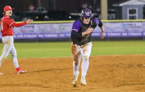 Columbia first baseman Max Schuler races to third base during Thursday's game against Bishop Snyder. (BRENT KUYKENDALL/Lake City Reporter)