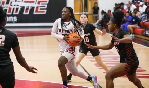 Fort White guard Zuri Hollie drives to the basket against Trenton during the Region 3-R semifinals on Thursday night. (BRENT KUYKENDALL/Lake City Reporter)