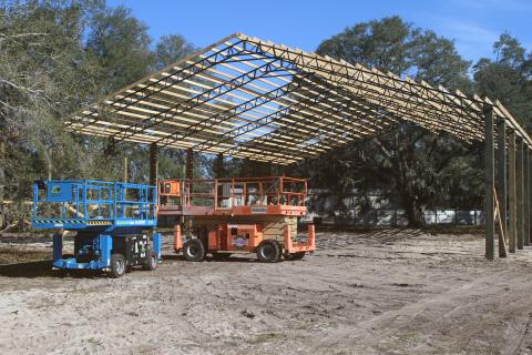 The pole barn at Cooper’s Hideout, which will cover a food truck area, a stage and gaming tables, is nearing completion. Eric Levy, the site’s owner, said the roof could be on the barn by the end of the week. (TONY BRITT/Lake City Reporter)