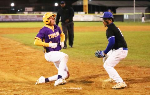 Columbia right fielder Tison McCray lets out a roar at third base after hitting a triple against Bartram Trail on Friday night. (BRENT KUYKENDALL/Lake City Reporter)