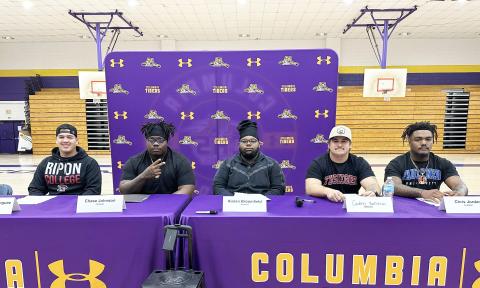 Columbia kicker Rolando Dominguez Jayo (from left), offensive lineman Chase Johnson, offensive lineman Kiaran Broomfield, defensive lineman Caden Bolstein and linebacker Chris Jordan signed letters of intent to play collegiately on Wednesday. Dominguez Jayo and Broomfield are headed to Ripon College, while Johnson and Bolstein will play at Tuskegee and Jordan will suit up for Faulkner. (JORDAN KROEGER/Lake City Reporter)