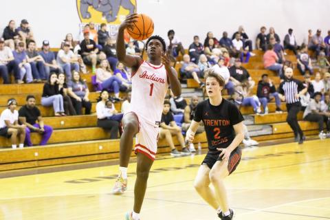 Fort White guard Jayden Jackson rises for a layup against Trenton in the District 6-R championship on Feb. 7. (BRENT KUYKENDALL/Lake City Reporter)