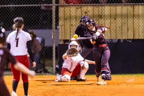 Fort White pitcher Hannah LeBleu knocks a base hit against Dixie County on Thursday. (JACK HOWDESHELL/Lake City Reporter)