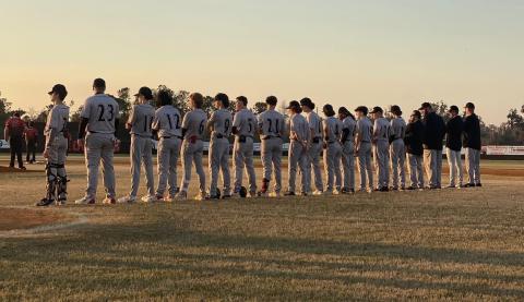 Fort White’s baseball team stands along the first-base line prior to Wednesday’s game against Hamilton County. (COURTESY)