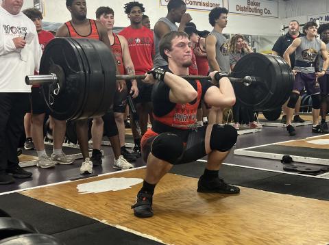 Fort White’s Hayden McCrory performs the clean and jerk during Wednesday’s tri-meet against Columbia and Baker County. (COURTESY)