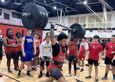 Fort White lifter Lecosta Byrd completes his clean and jerk during Monday’s meet. (COURTESY)
