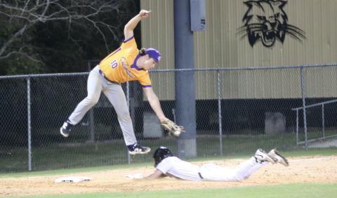 Buchholz shortstop Hudson Sapp slides safely into third base under the tag of Columbia third baseman Ayden Phillips on Friday night. (JORDAN KROEGER/Lake City Reporter)