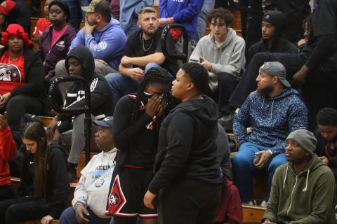 Fort White coach Bregay Harris hugs guard Zuri Hollie after Hollie fouled out in overtime of the Indians’ 67-64 loss to Hilliard in the Region 3-R championship. (MORGAN MCMULLEN/Lake City Reporter)