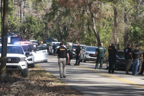 Columbia County Sheriff’s Office deputies arrive at the scene on SW Washington Avenue in Fort White in response to an officer-involved shooting Wednesday morning. (MORGAN MCMULLEN/Lake City Reporter)