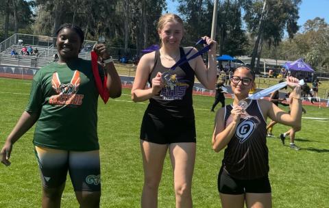 Columbia's Kyndall Norris shows off her first-place medal after winning the javelin at the SFHS Raiders Invitational on Saturday. (COURTESY)