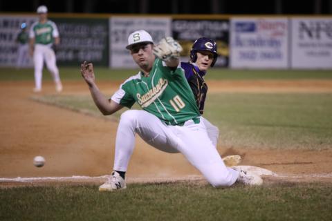 A throw gets past Suwannee third baseman Koy Frier, allowing Columbia shortstop Logan Brooks to score the go-ahead run in the fifth inning Tuesday night. (BRENT KUYKENDALL/Lake City Reporter)