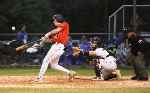 Fort White's Teagan Bell makes contact with a pitch against Branford on March 10. (BRENT KUYKENDALL/Lake City Reporter)